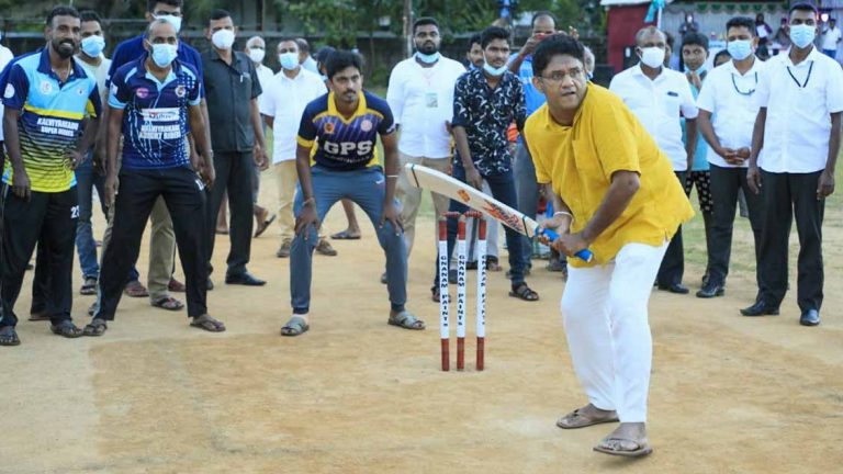 Sajith Premadasa plays cricket with a group of young people in the North