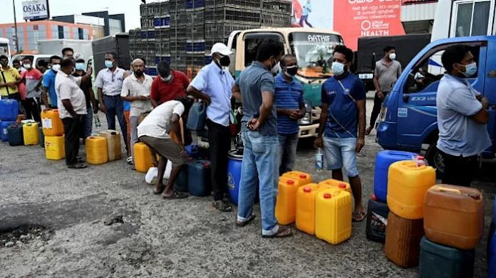 people-stand-in-a-queue-to-buy-diesel-fuel-at-a-petrol-station-in-sri-lanka