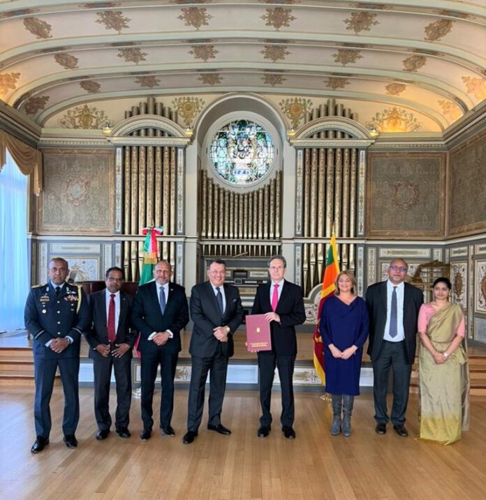 Ambassador Samarasinghe presents copies of his letter of credence as ...