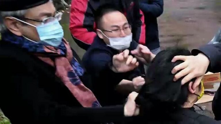 Chinese consul-general defends actions after being seen pulling protester’s hair in Manchester