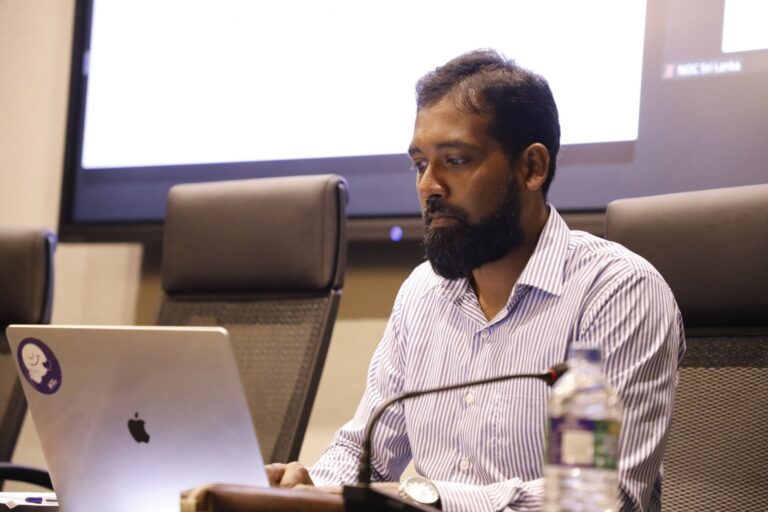 The Olympic media manager was arrested while trying to leave the country